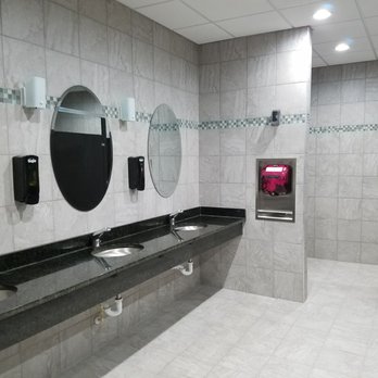 Planet Fitness - The new updated bathrooms. A lot of beautiful tile used with fancy mirrors and sinks. - Trainers Near Me - Melbourne, Florida