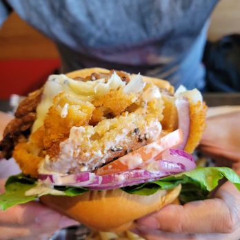 The Crowsnest Pub - a person holding a sandwich - Pubs Near Me - Tobermory, Ontario The Crowsnest Pub - a person holding a sandwich - Pubs Near Me - Tobermory, Ontario
