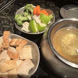 Simply Fondue - Our Cheese Fondue appetizer. Heating the beer base before melting Monterey Jack cheese and garlic