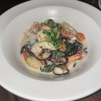 Ena - PASTA NEGRA - 8/10 Squid ink pasta, spinach, fennel, brussels sprouts, scallops, shrimp, calamari, roasted garlic salsa, asiago cheese. - Latin American Near Me - Minneapolis, Minnesota Ena - PASTA NEGRA - 8/10 Squid ink pasta, spinach, fennel, brussels sprouts, scallops, shrimp, calamari, roasted garlic salsa, asiago cheese. - Latin American Near Me - Minneapolis, Minnesota