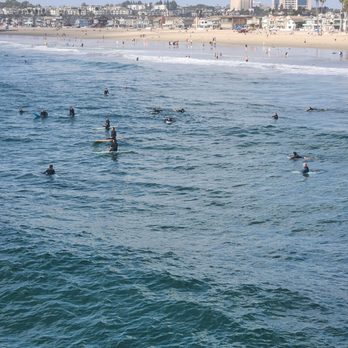 Newport Pier - Surfers waiting for that perfect wave! - Landmarks & Historical Buildings Near Me - Newport Beach, California