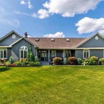 Chickadee Realty & Design - Lovely landscaping frames this house - Real Estate Agents Near Me - Calgary, Alberta
