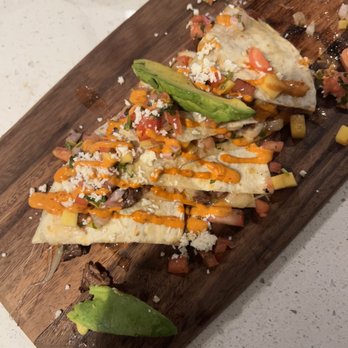Tequila’s Mexican Cantina - Probably 2/3 of the quesadilla - I took some bites before taking the pic. It was amazing overall - Mexican Near Me - Hudson, Massachusetts