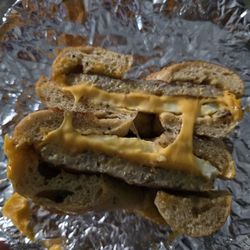 Bagel Port Cafe & Deli - Cross section of sausage and and cheese. Needs another egg. 1 isn't enough.