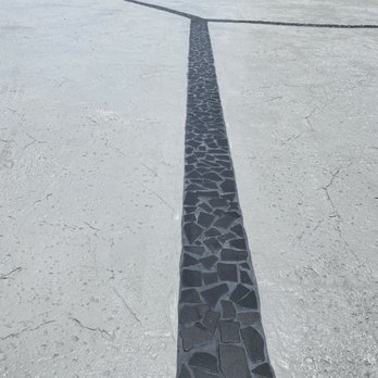 The Grout Doctor - Honolulu - Newly replaced grouted stone driveway channels. - Tiling Near Me The Grout Doctor - Honolulu - Newly replaced grouted stone driveway channels. - Tiling Near Me