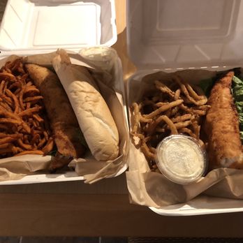 My Sister's Place - Double walleye sandwiches: one with sweet potato fries (left) and one with onion rings (right). Both tasty, and a TON of food! - American Near Me - Grand Marais, Minnesota My Sister's Place - Double walleye sandwiches: one with sweet potato fries (left) and one with onion rings (right). Both tasty, and a TON of food! - American Near Me - Grand Marais, Minnesota