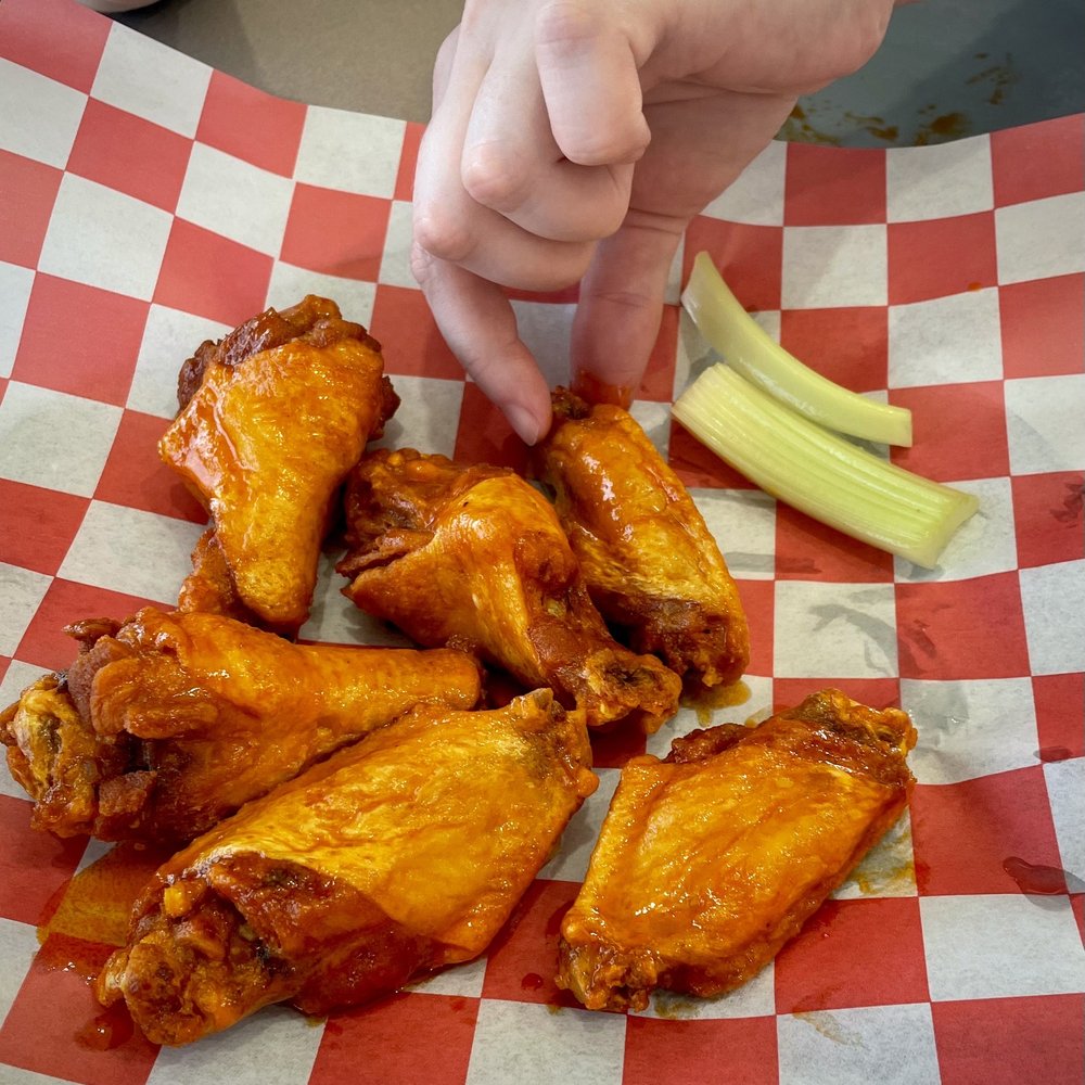 The Pizza Box - Mild Buffalo wings with celery sticks - Pizza Near Me - Virginia Beach, Virginia The Pizza Box - Mild Buffalo wings with celery sticks - Pizza Near Me - Virginia Beach, Virginia