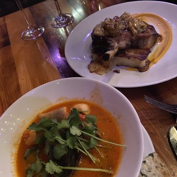 Union 50 - Top: Tomahawk Pork Chop. Bottom: Cioppino. Not pictured: Medjool Dates - Gastropubs Near Me - Indianapolis, Indiana