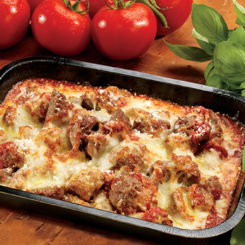 Marco's Pizza - a pan of lasagna and tomatoes - Pizza Near Me - Youngstown, Ohio