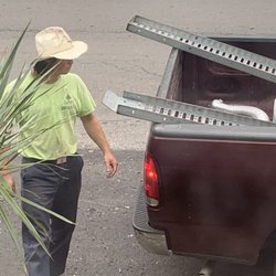 Garden Specialties - Worker walking around truck