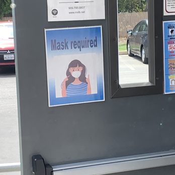 Calimesa Public Library - Signage promoting mask wearing on inside door of library - Libraries Near Me - Calimesa, California