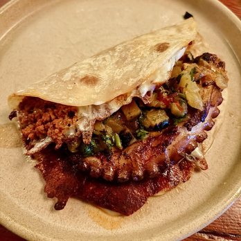 Daisy - Taco De Pulpo | $10 | flour tortilla, grilled octopus, chorizo, queso oaxaca, pineapple pico - Cocktail Bars Near Me - Los Angeles, California Daisy - Taco De Pulpo | $10 | flour tortilla, grilled octopus, chorizo, queso oaxaca, pineapple pico - Cocktail Bars Near Me - Los Angeles, California