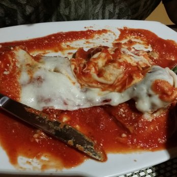 Galleria - Galleria Special (half-eaten already). It's veal cutlet parmigiana, eggplant parmigiana, and meatballs, all covered in mozzarella cheese. - Pizza Near Me - Merrick, New York Galleria - Galleria Special (half-eaten already). It's veal cutlet parmigiana, eggplant parmigiana, and meatballs, all covered in mozzarella cheese. - Pizza Near Me - Merrick, New York