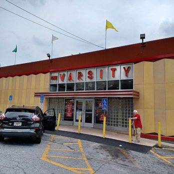The Varsity - a parking lot with cars parked in front of it - Burgers Near Me - Atlanta, Georgia The Varsity - a parking lot with cars parked in front of it - Burgers Near Me - Atlanta, Georgia