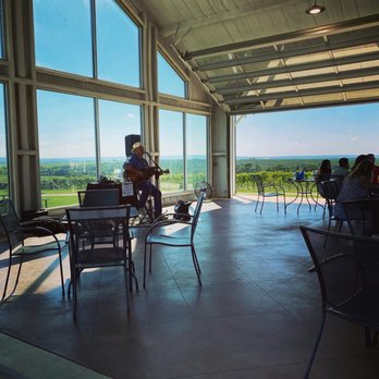 Blue Ostrich Winery - a man playing a guitar - Wineries Near Me - Saint Jo, Texas Blue Ostrich Winery - a man playing a guitar - Wineries Near Me - Saint Jo, Texas