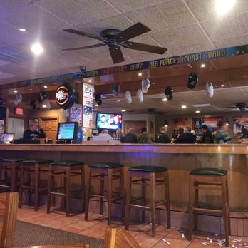 Pearly Gates Bar & Grill - The bar at The Pearly Gates, look down to see how the regulars faired with the pull tabs. The losers are on the floor. - Sports Bars Near Me - Green Bay, Wisconsin
