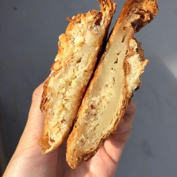 Golden Wheat - Inside of almond croissant (left half has been bitten) - Specialty Food Near Me - Hamtramck, Michigan