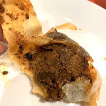 Bavu Villas - Had to peel off to reveal the 'all mutton' insides of this bad boy - Sri Lankan Near Me - Toronto, Ontario
