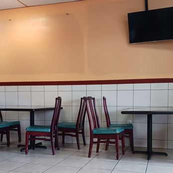Peng's Asian Cuisine - tables and chairs in a restaurant - Asian Fusion Near Me - Orlando, Florida Peng's Asian Cuisine - tables and chairs in a restaurant - Asian Fusion Near Me - Orlando, Florida