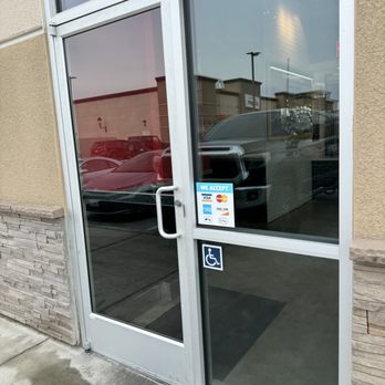 Fatburger & Buffalo's Express - the reflection of a car in the window - Burgers Near Me - Clovis, California