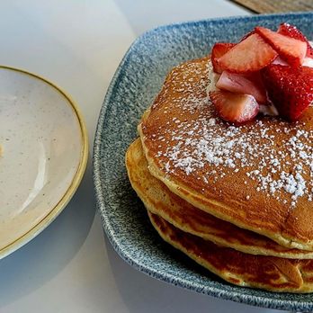 Hau Tree - Calamansi Ricotta Pancakes ($23.00) - calamansi curd, sweet ricotta, fresh fruit & a side order of two scambled eggs. - Seafood Near Me - Honolulu, Hawaii Hau Tree - Calamansi Ricotta Pancakes ($23.00) - calamansi curd, sweet ricotta, fresh fruit & a side order of two scambled eggs. - Seafood Near Me - Honolulu, Hawaii