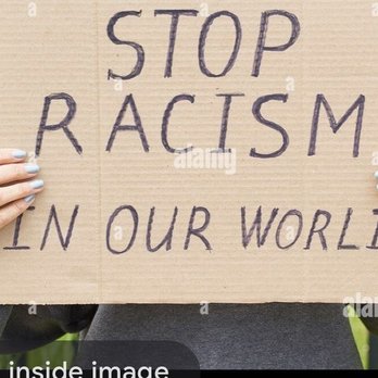Joe Mama's - a woman holding a sign that reads stop racism in our world - stock image - American Near Me - Millbrook, Alabama Joe Mama's - a woman holding a sign that reads stop racism in our world - stock image - American Near Me - Millbrook, Alabama