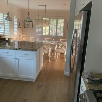 Ikon Builders - We painted kitchen cabinetry with new wood floors - Damage Restoration Near Me - San Juan Capistrano, California