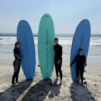 SoCal Surf Lessons - All three of my kids standing with their surfboards after surfing lessons in Carlsbad, CA - Surf Schools Near Me SoCal Surf Lessons - All three of my kids standing with their surfboards after surfing lessons in Carlsbad, CA - Surf Schools Near Me