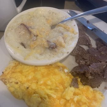 Shamrock Restaurant - Ribeye steak cheese eggs and grits with cheese and bacon - American Near Me - Williamston, North Carolina Shamrock Restaurant - Ribeye steak cheese eggs and grits with cheese and bacon - American Near Me - Williamston, North Carolina