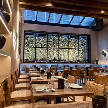 Casa Carmen - a dining area with tables and chairs - Mexican Near Me - New York, New York