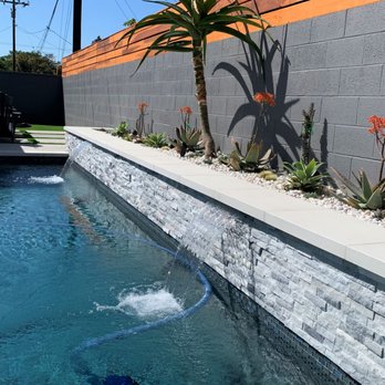 East Long Beach Pool And Spa - Spillways creating a blissful soundscape in this pool and spa we built. Planters, swimming pool builders in Southern California - Pool Cleaners Near Me - Long Beach, California East Long Beach Pool And Spa - Spillways creating a blissful soundscape in this pool and spa we built. Planters, swimming pool builders in Southern California - Pool Cleaners Near Me - Long Beach, California