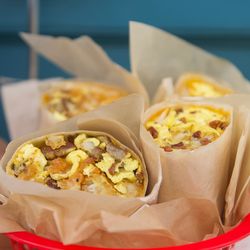 On The Alley - Goleta - Breakfast burritos; Large flour tortilla with 3 scrambled eggs, choice of tater tots or potatoes, add chorizo, bacon, or sausage + $2.75