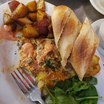Cafe Bonjour - Bonjour Omelette w/ Baguette (half eaten) - Breakfast & Brunch Near Me - Boston, Massachusetts Cafe Bonjour - Bonjour Omelette w/ Baguette (half eaten) - Breakfast & Brunch Near Me - Boston, Massachusetts