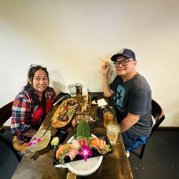 M Sushi Bistro - Hubby and me with all the colorful food on our table - Sushi Bars Near Me - Lodi, California