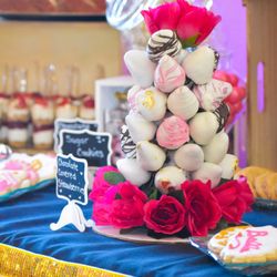 The #1 Pound Cake Man - Chocolate Covered Strawberry Tower with a glance of a sweets table for baby shower