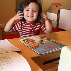 The Village Educational Center - Exploring books at the listening center