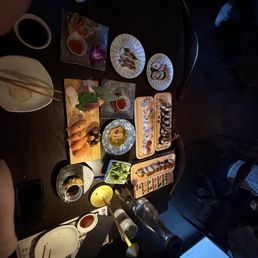 Table full of yummy food on cute little plates Table full of yummy food on cute little plates