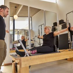 Tether Pilates - Maggy focusing on keeping her shoulders relaxed and keeping the work out of her trapezius.