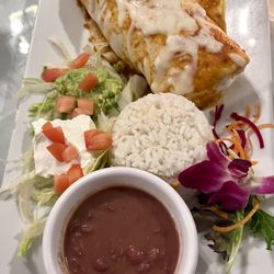 El Matador Restaurant - Veggie Burrito with guacamole, sour cream, beans, and rice