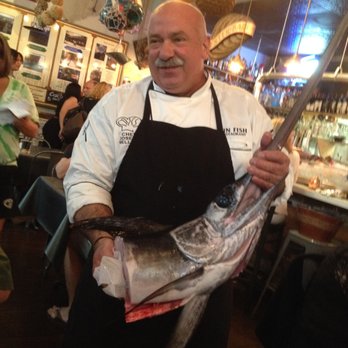 Tin Fish - Owner with fresh swordfish - New American Near Me - Sunrise, Florida