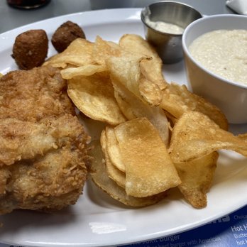 The Fish Joint - Fried Grouper, cheese grits, hush puppies, and homemade chips. - Seafood Near Me - Coconut Creek, Florida The Fish Joint - Fried Grouper, cheese grits, hush puppies, and homemade chips. - Seafood Near Me - Coconut Creek, Florida