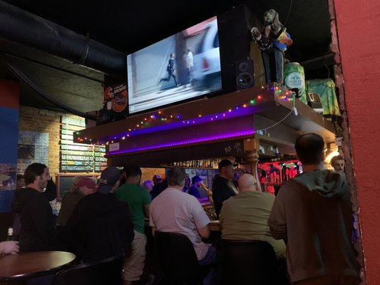 Photo of Zephyr Pub & Spirits - Kent, OH, US. View of the bar with one of the many TVs (typically playing some type of movie like Fast & Furious)