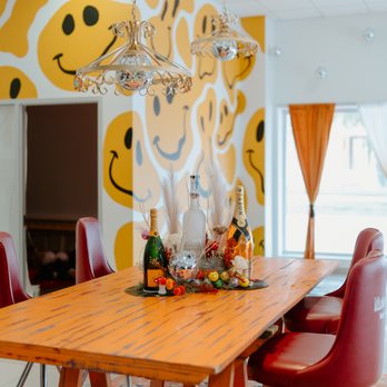 Mac’s Daqs Bar and Lounge - a dining room with a smiley face wallpaper - Lounges Near Me - La Grange, Texas Mac’s Daqs Bar and Lounge - a dining room with a smiley face wallpaper - Lounges Near Me - La Grange, Texas