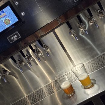 Eupouria Bar & Patio - the taps and pint glasses - Bars Near Me - Columbus, Ohio