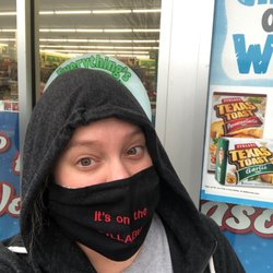 Dollar Tree - Me standing outside dollar tree at 9:32 in the rain. They open at 9:00.