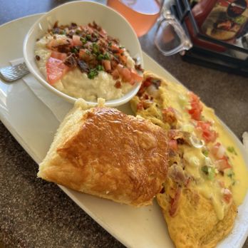 Another Broken Egg Cafe - Mario Gras Omelette, paired with a biscuit & city grits. 9/10 - Breakfast & Brunch Near Me - Burbank, California Another Broken Egg Cafe - Mario Gras Omelette, paired with a biscuit & city grits. 9/10 - Breakfast & Brunch Near Me - Burbank, California