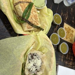 Fast Taco - Carne asada burrito with guacamole on the side and one carne asada taco with cheese