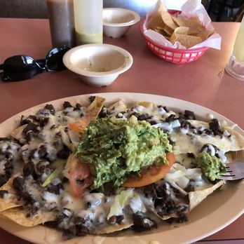 Casa De Leon - Beef fajita nachos with guacamole (extra) - Mexican Near Me - Houston, Texas Casa De Leon - Beef fajita nachos with guacamole (extra) - Mexican Near Me - Houston, Texas