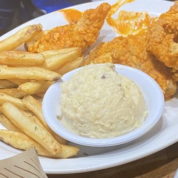 Cheddar's Scratch Kitchen - Chicken Tenders with Buffalo sauce, French Fries and Idaho Mashed Potatoes - American Near Me - Warner Robins, Georgia Cheddar's Scratch Kitchen - Chicken Tenders with Buffalo sauce, French Fries and Idaho Mashed Potatoes - American Near Me - Warner Robins, Georgia