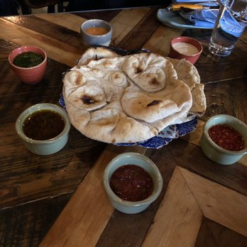 Maydan - Bread with all the condiments. Enjoyed all but the tomato. - Moroccan Near Me - Washington, DC, District of Columbia